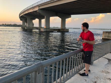 Angler fishing at the Perdido Pass Seawall in Orange Beach