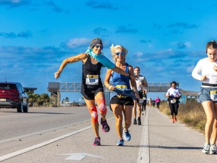 Ladies running a marathon on Alabama's Beaches