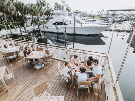 Aerial view of people dining at Shipp's waterfront restaurant in Orange Beach