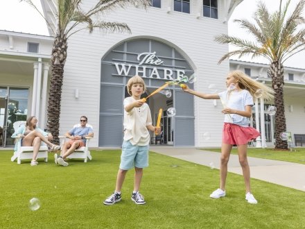 Kids playing with bubbles at The Wharf
