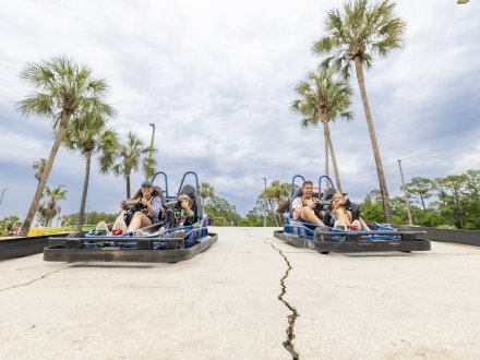 Family racing go-karts at The Track Family Fun Park attraction in Gulf Shores