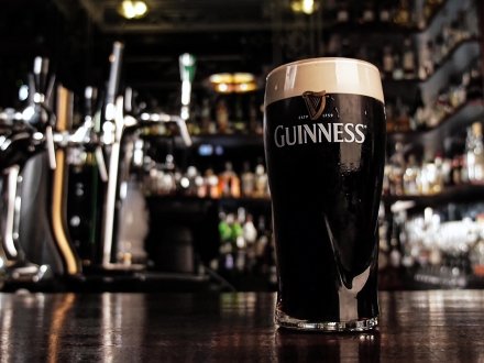 Pint of Guinness sitting on a bar