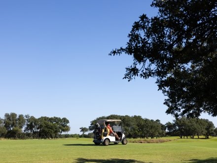Golf Cart on the greens at Kiva Dunes Golf Resort