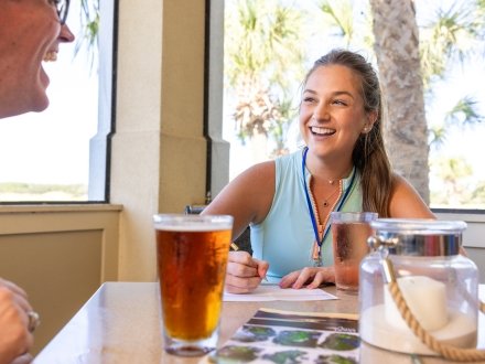 Friends enjoying beers at Kiva Dunes Clubhouse Kiva Grill in Fort Morgan