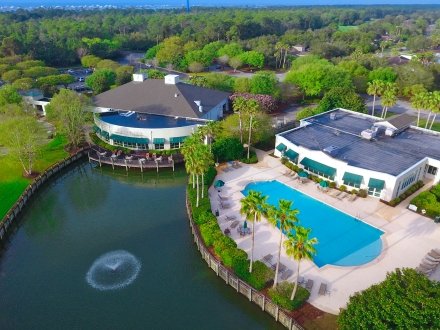 Aerial view of the Clubhouse and pool at Peninsula Golf & Racquet Club in Fort Morgan