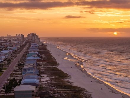 Aerial view of sunrise over the Gulf at West Beach in Gulf Shores