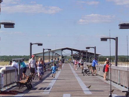 Families fishing at the Gulf State Park Fishing Pier in Gulf Shores