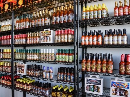 Rows of hot sauce at the Pepper Palace specialty food store at The Wharf in Orange Beach