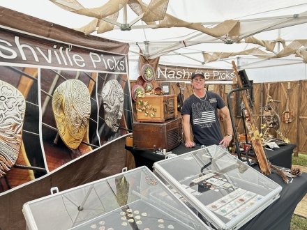 Folk art vendor booth at the Orange Beach Festival of Art