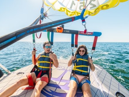 Couple parasailing during a spring trip on Alabama's Beaches