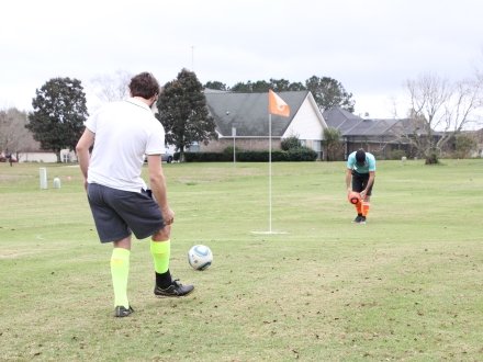 Men playing foot golf at GenLakes golf course in Foley