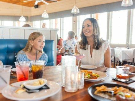 Family dining at Jesse's on the Bay fine dining waterfront restaurant in Fort Morgan