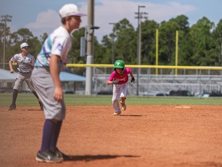 Kids playing baseball during the Perfect Game Baseball Tournament in Gulf Shores