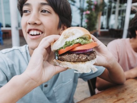Kid eating a burger at Cobalt