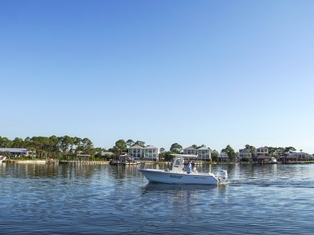 Boat cruising in the water in Orange Beach