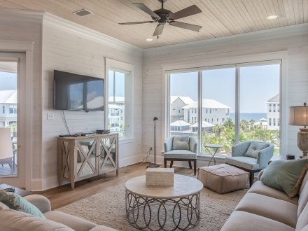 Romar Cottage in Orange Beach, Alabama, featuring a cozy, spacious living room with ocean views and modern coastal decor