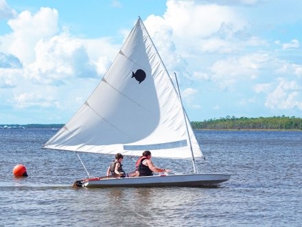 Family learning to sail at the Wind & Water Learning Center in Orange Beach