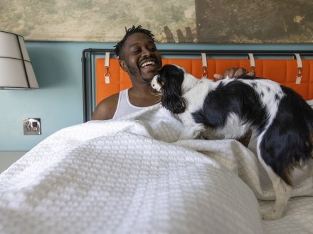 A man with his dog at hotel indigo