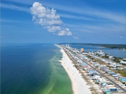 Aerial view of the Gulf and beach houses on Fort Morgan