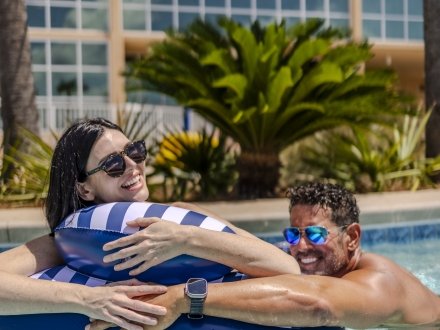 Couple enjoying the lazy river at their rental on Alabama's Beaches