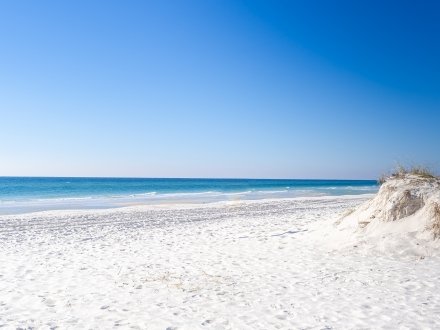 scenic view of white sand and blue waters at Gulf Shores beach