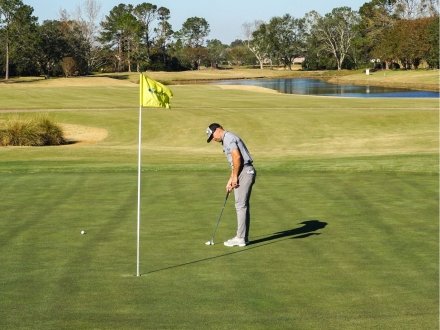 Man golfing at Craft Farms golf course in Gulf Shores