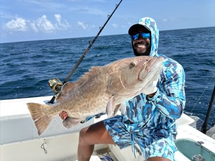 Man with the Gag Grouper he caught on Alabama's Beaches
