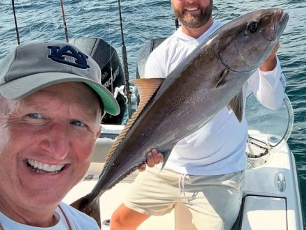Men with the Amberjack they caught on Alabama's Beaches