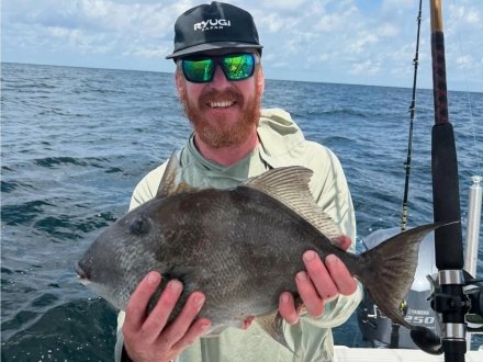 Man with a triggerfish on Alabama's Beaches