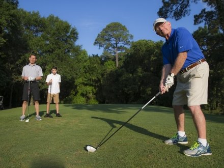 Family golfing at Peninsula Golf & Racquet Club in Gulf Shores