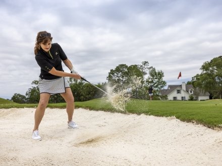Golfer playing at Craft Farms Arnold Palmer golf course in Gulf Shores