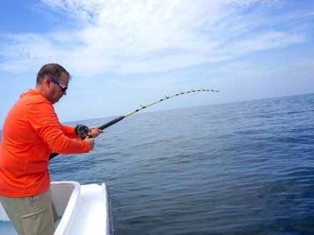 Angler fishing on a offshore fishing charter in Orange Beach