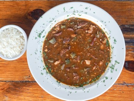 A bowl of gumbo and a side of rice from Tin Top Resaurant