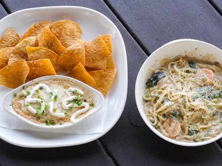 Blue crab dip and seafood pasta from Ginny Lane Bar and Grill at The Wharf