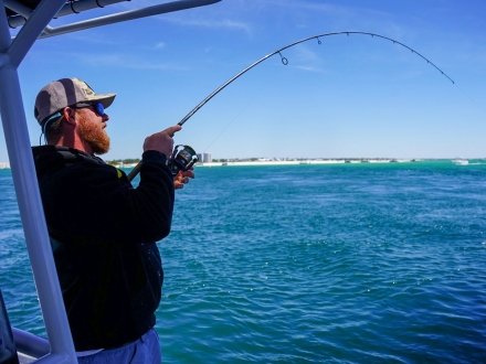 Man fishing from a charter boat near Perdido Pass in Orange Beach