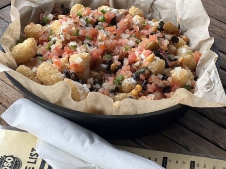 Loaded tater tots at OSO waterfront restaurant in Bear Point