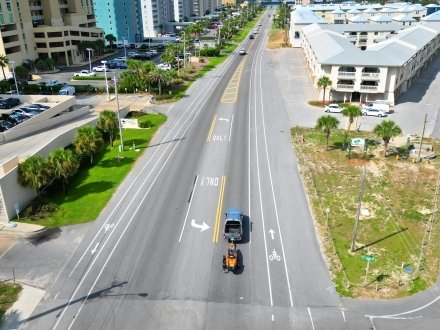 Aerial view of cars driving along Perdido Beach Blvd. in Orange Beach