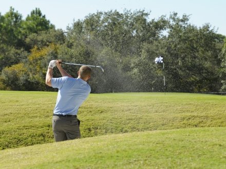 Golfer playing at Kiva Dunes Golf Resort in Fort Morgan