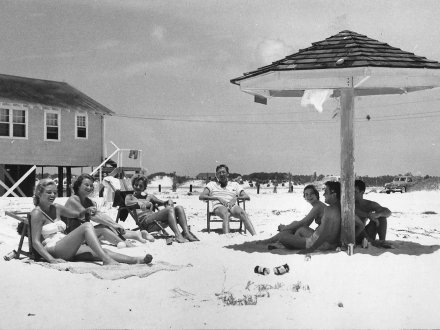 vintage photo of friends hanging out on the beach