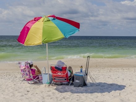 Rainbow umbrella and beach chairs along Alabama's Beaches