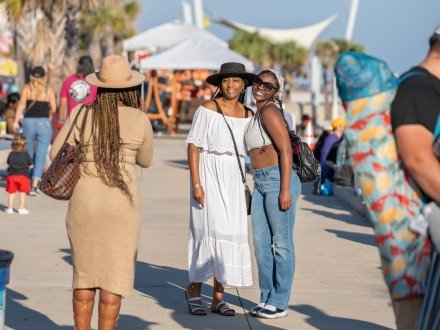 Friends posing for a photo at the Annual Shrimp Festival in Gulf Shores