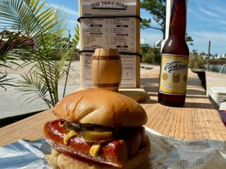 Conecuh sausage burger at Tap & Still waterfront restaurant in Gulf Shores