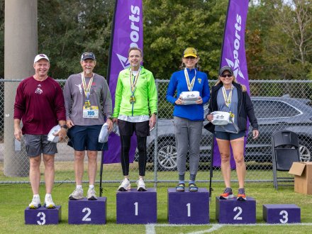 Runners receiving their awards at the Coastal Half Marathon on Alabama's Beaches