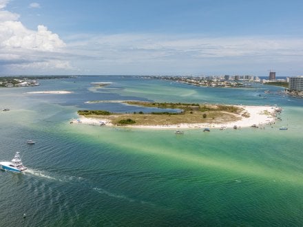 Aerial view of boats cruising around the islands in Orange Beach