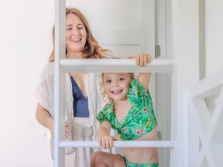 Mom and little girl in a beach house at Beach Village Resort in Orange Beach