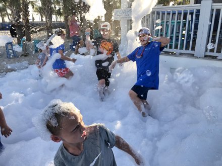 Kids playing at a foam party at The Hangout beachfront restaurant in Gulf Shores
