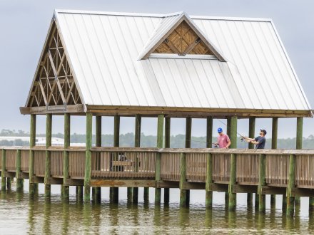 Anglers inshore fishing at the Waterfront Park Pier in Orange Beach