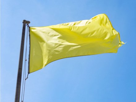 yellow beach safety flag