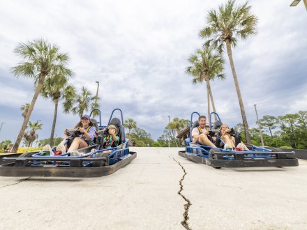Family racing go-karts at The Track family-friendly attraction in Gulf Shores