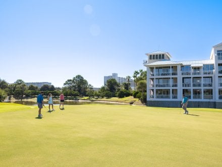 Friends playing golf at Kiva Dunes Golf Resort in Fort Morgan